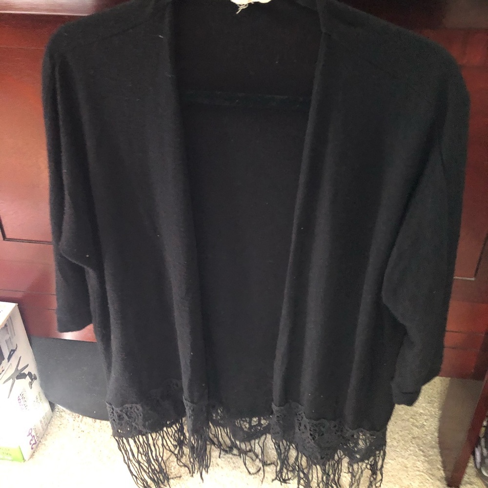 Loose fitting black cardigan with fringe